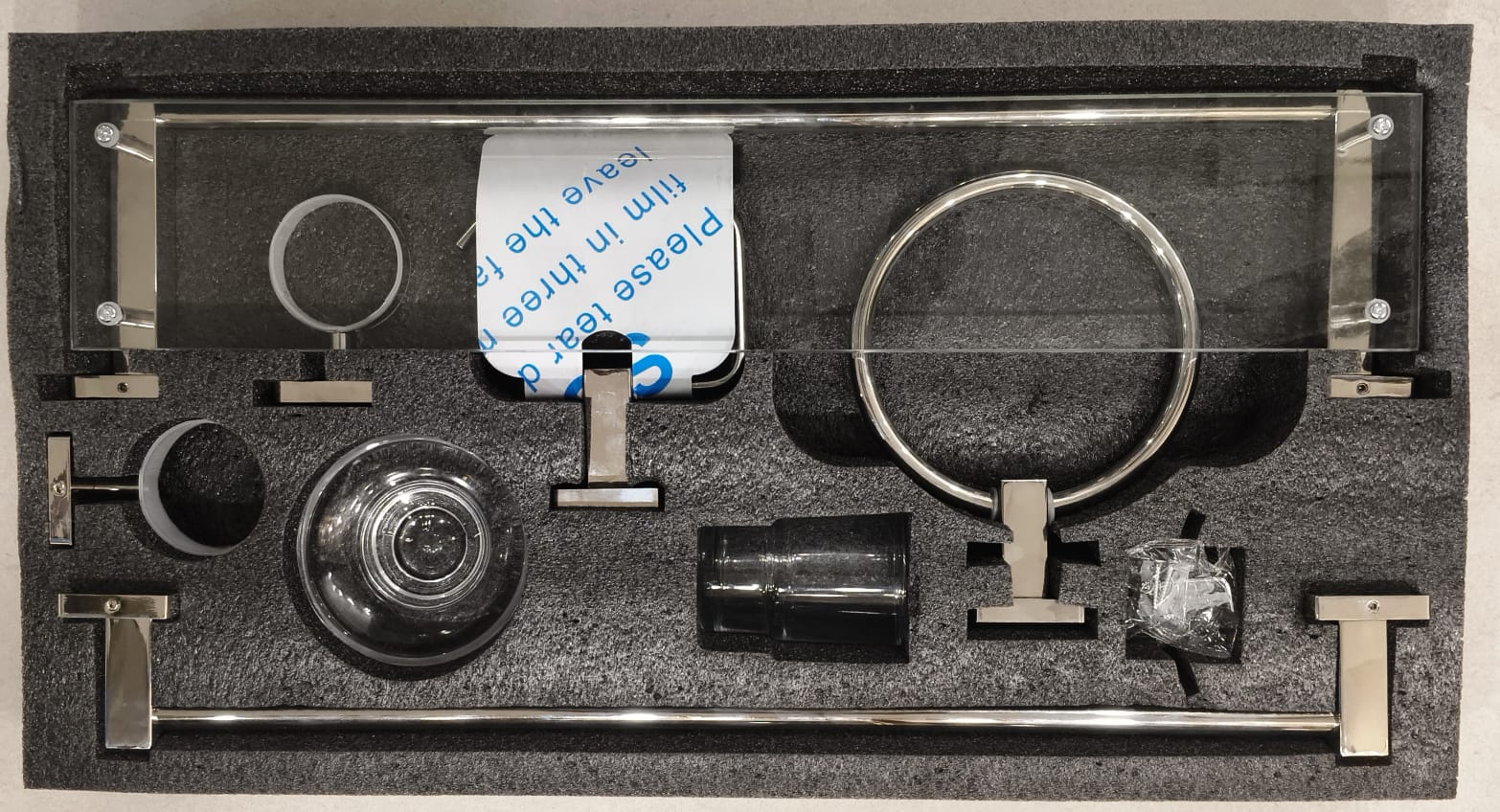 Set of optical components in a black foam tray with a label.