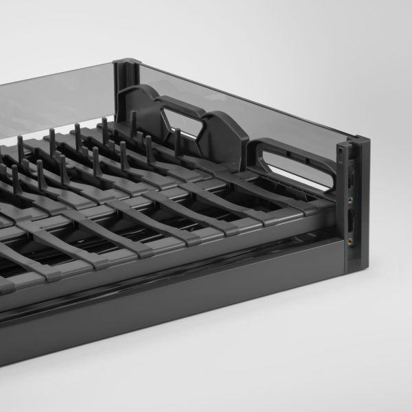 Black metal tray with grid design on a white background