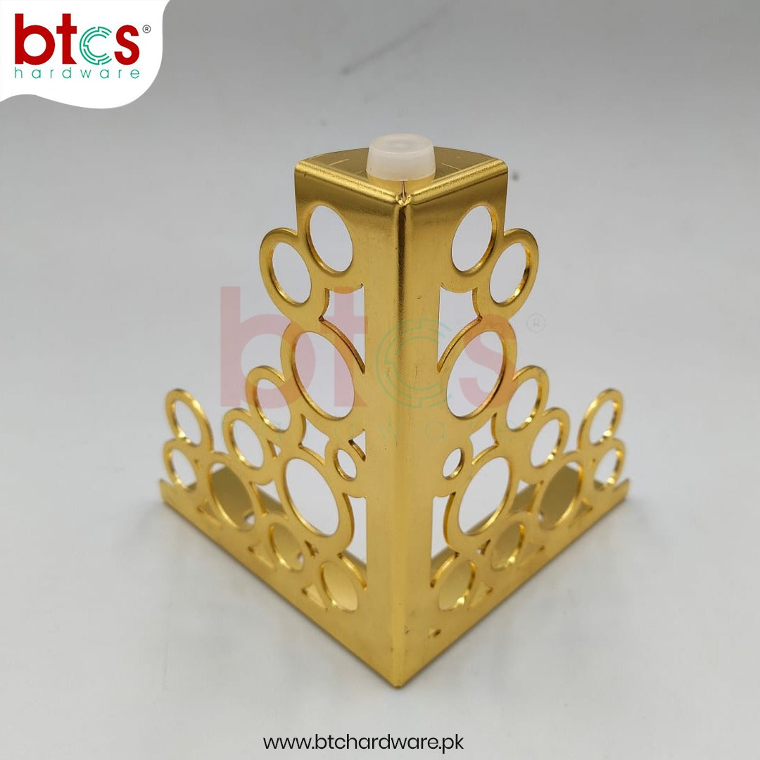 Gold decorative corner bracket with intricate cut-out design 