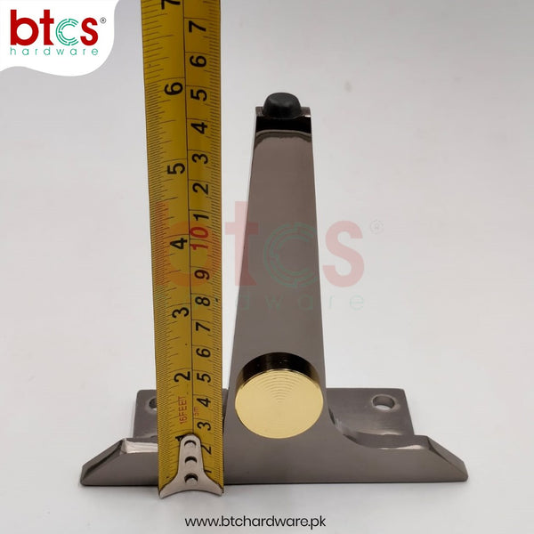 Metal bracket with gold circular component and measuring tape for scale on a white background, featuring BTCS Hardware branding.