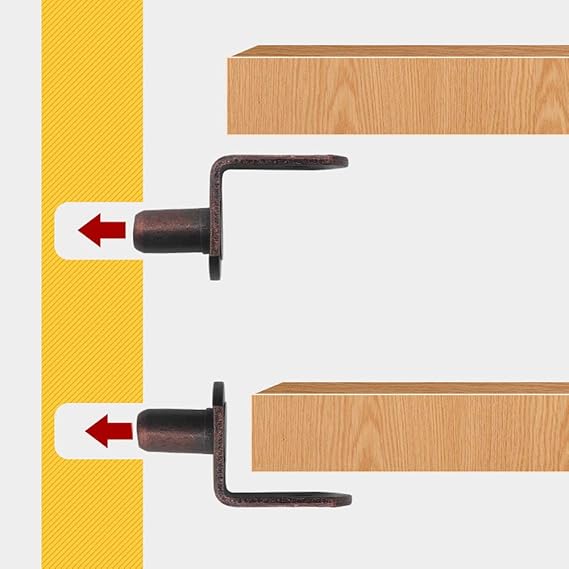 Metal door handles on wooden doors with a yellow vertical stripe and red arrows indicating direction.