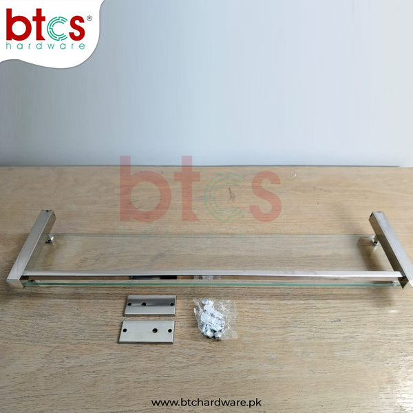 Metal towel rack with hardware components on a wooden surface, featuring btcs hardware branding.