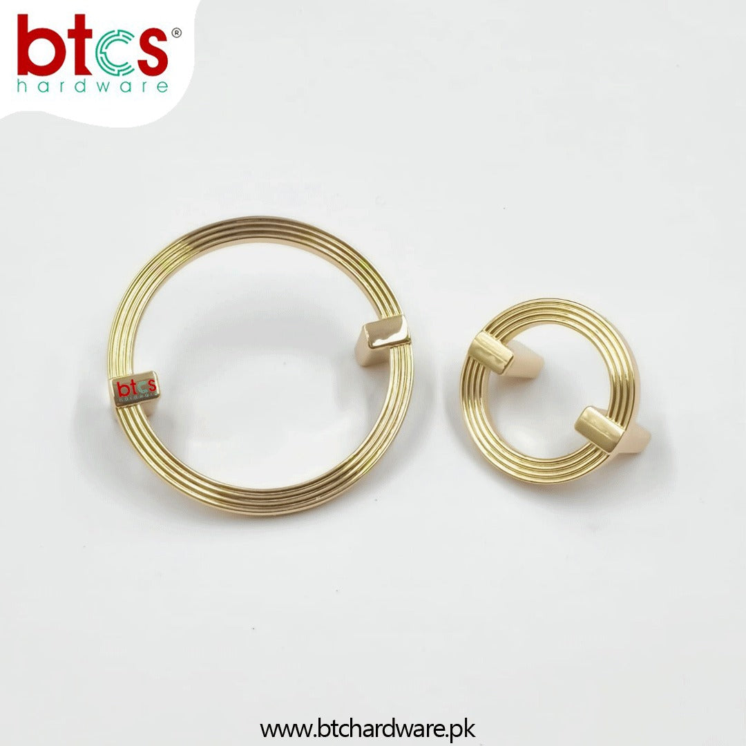 Two gold circular metal washers 